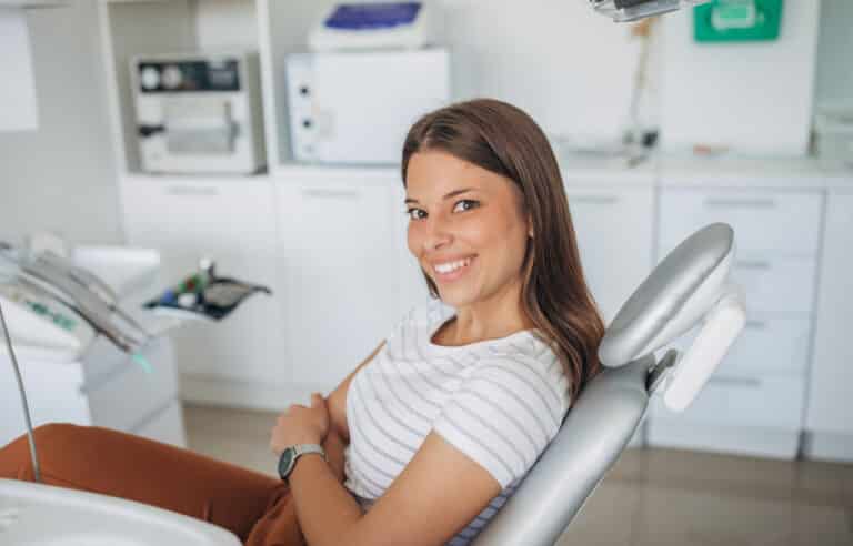 Woman sitting in dentist's chair